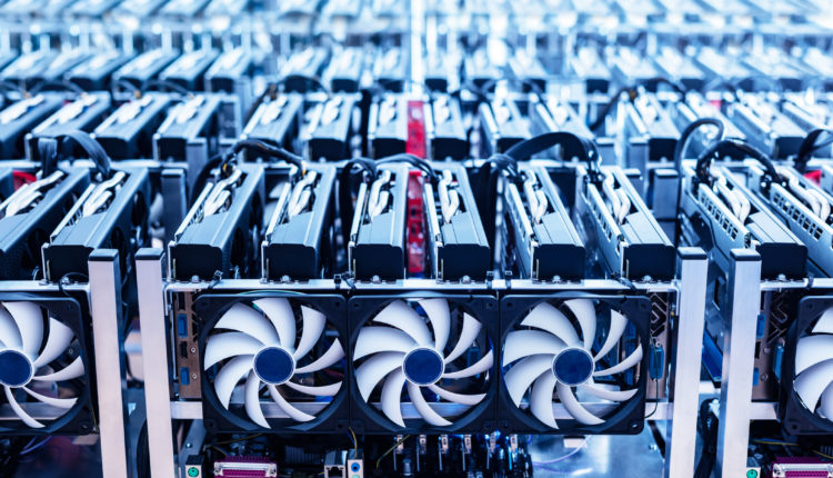 Bitcoin mining farm. IT hardware. Electronic devices with fans. Cryptocurrency miners.