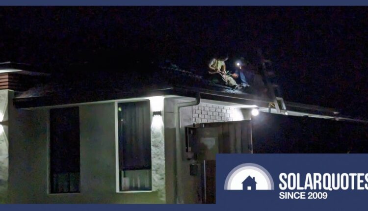 Solar panel installers working at night