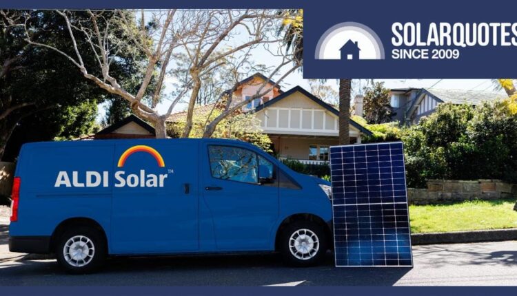 An Aldi Solar van next to a solar panel