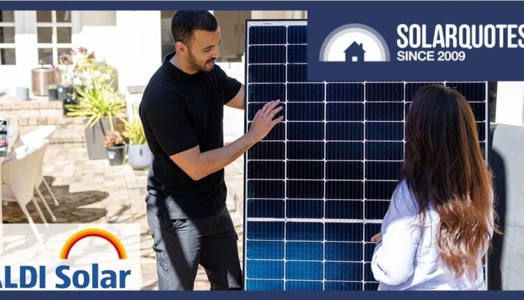 Man showing woman solar panel.